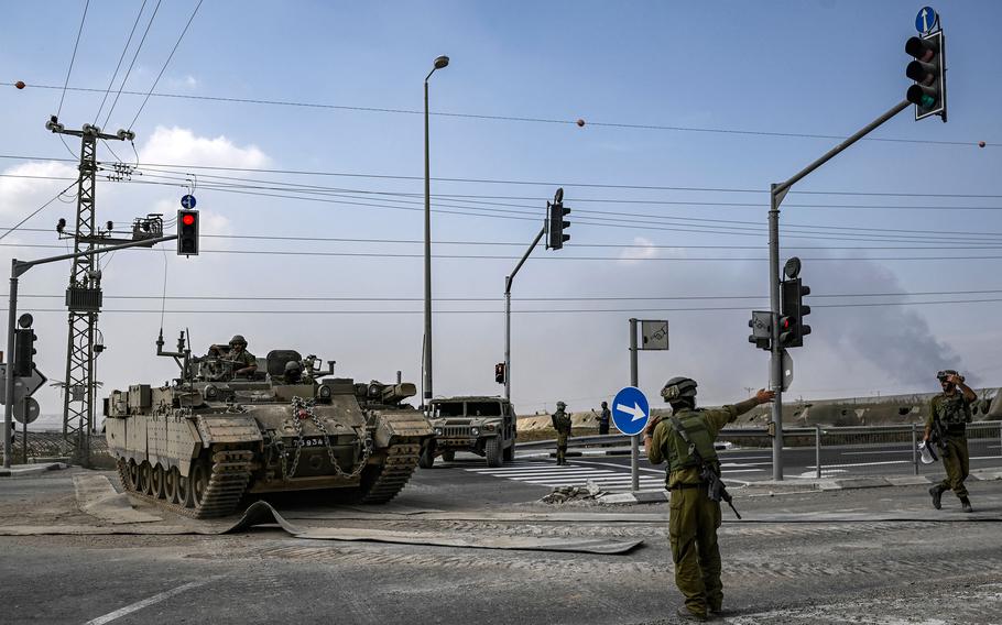 An Isreaeli armoured personnel carrier on the move near the Gaza border in southern Israel on Saturday, Oct. 14, 2023.