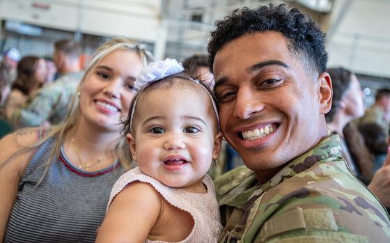 A member of Task Force Tomahawk reunites with their family during a ...