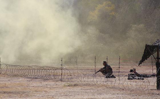 Lop Buri, Thailand, Feb. 9, 2009: Smoke grenades cloud a mock United Nations humanitarian relief distribution station under attack in Lop Buri, Thailand, during a training drill for Cobra Gold ’09. The joint, multinational exercise which ranges from amphibious assaults to humanitarian evacuations was held at more than a dozen locations across the Thai kingdom and involved nearly 7,000 U.S. troops who were joined by more than 4,000 others from Thailand, Japan, Indonesia and Singapore. The 28th Cobra Gold exercise had two objectives: to teach coalition warfare and provide tactical training.

Read more at: https://www.stripes.com/migration/cobra-gold-2009-building-trust-high-on-the-agenda-1.88012