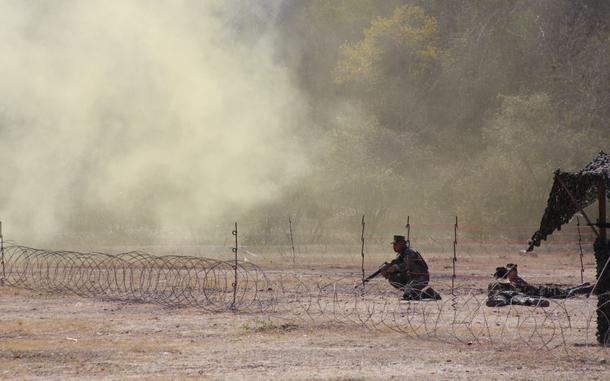 Lop Buri, Thailand, Feb. 9, 2009: Smoke grenades cloud a mock United Nations humanitarian relief distribution station under attack in Lop Buri, Thailand, during a training drill for Cobra Gold ’09. The joint, multinational exercise which ranges from amphibious assaults to humanitarian evacuations was held at more than a dozen locations across the Thai kingdom and involved nearly 7,000 U.S. troops who were joined by more than 4,000 others from Thailand, Japan, Indonesia and Singapore. The 28th Cobra Gold exercise had two objectives: to teach coalition warfare and provide tactical training.

Read more at: https://www.stripes.com/migration/cobra-gold-2009-building-trust-high-on-the-agenda-1.88012