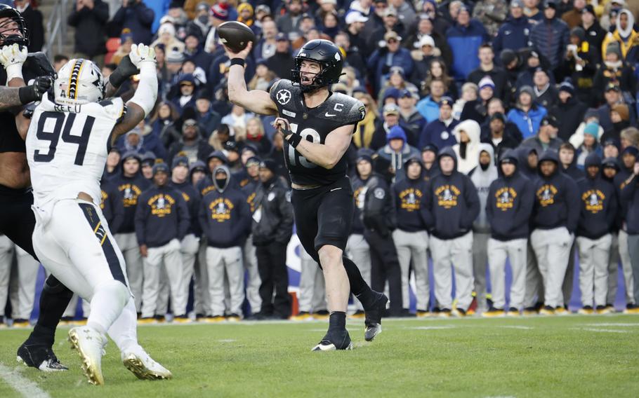 Army’s quarterback throws a pass.