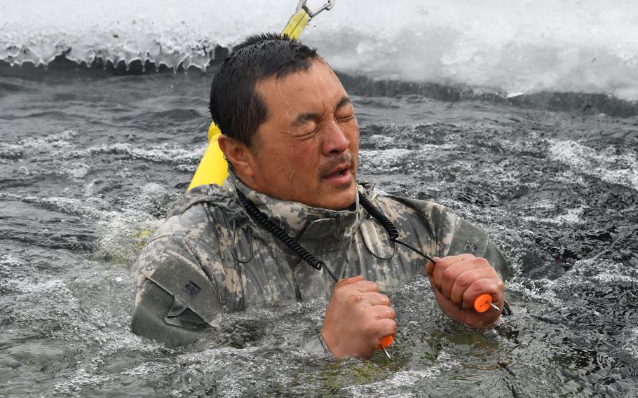 An airman participates in a cold-water immersion