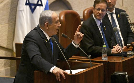 Israeli Prime Minister Benjamin Netanyahu speaks at the opening of the 25th Knesset session marking the anniversary of the "Iron Swords" war, in Jerusalem, Monday, Oct. 28, 2024. (Debbie Hill/Pool Photo via AP)