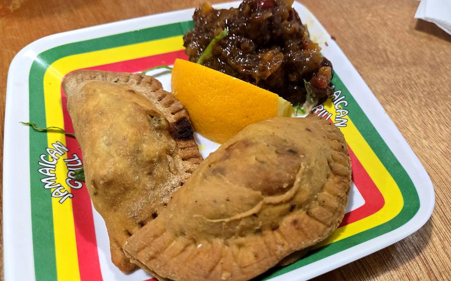 The empanadas from the Jamaican Grill on Guam are chock full of flavor and served with a side of sweet fruit chutney. 