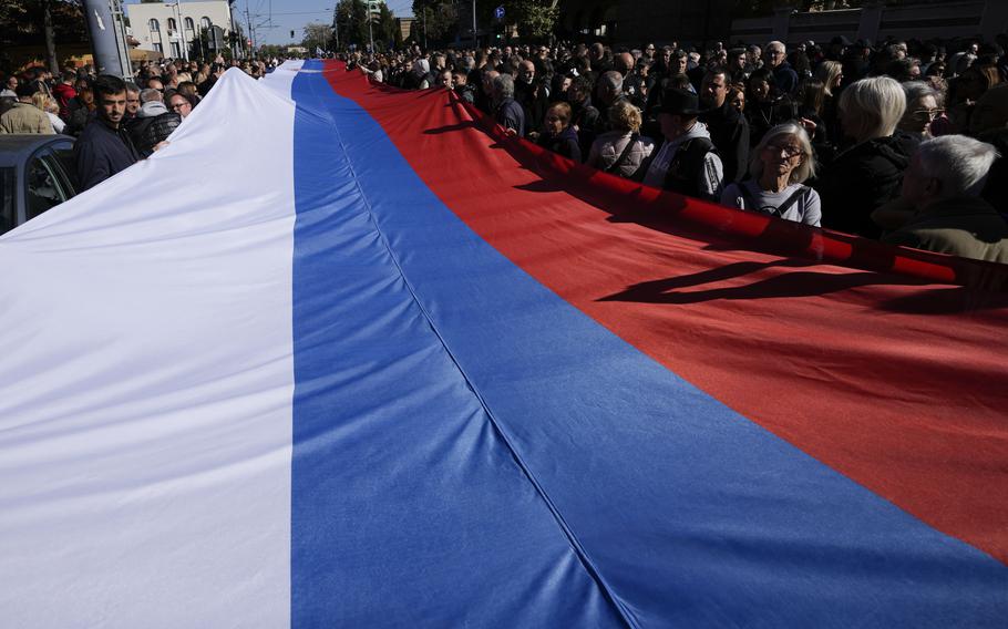 A giant Serbian flag is rolled out to mark the 80th anniversary of the liberation of Belgrade from Nazi occupation.