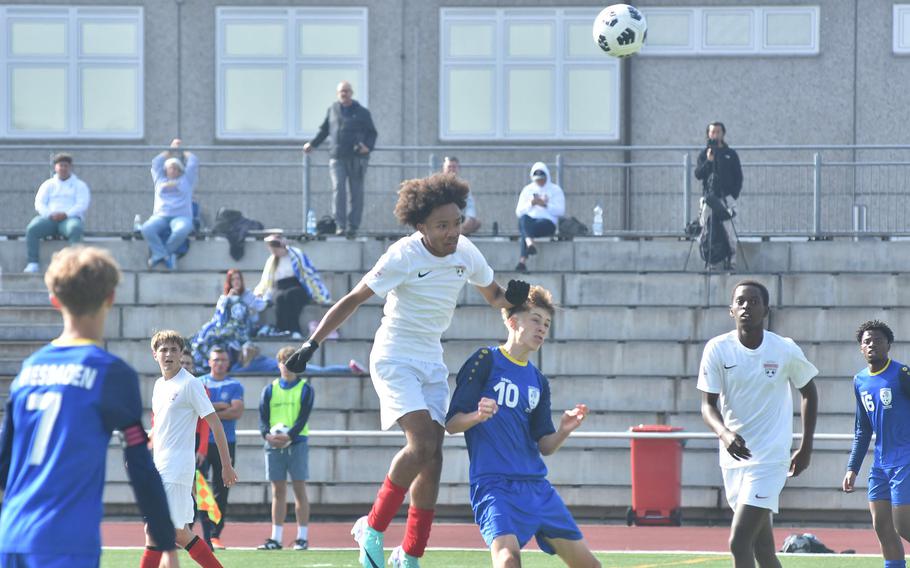 Kaiserslautern's Gabe Urquhart heads the ball in a match against Wiesbaden on the opening day of the DODEA European Division I boys soccer championships on Monday, May 20, 2024, in Kaiserslautern, Germany.