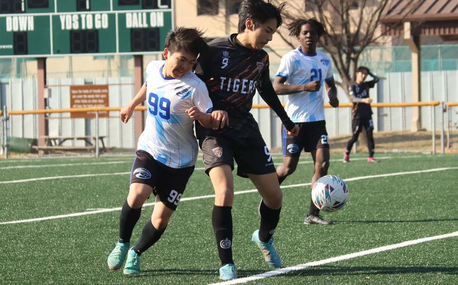 John Krabbe battles for the ball.