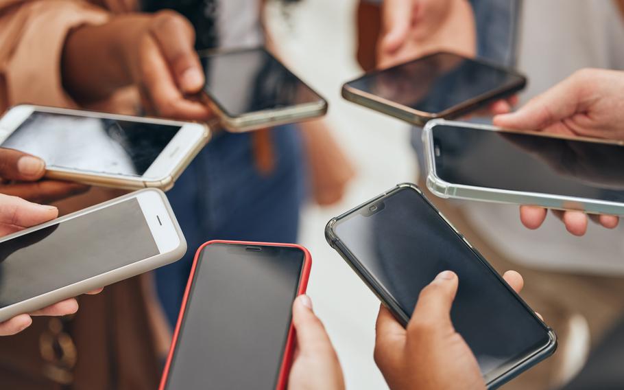 Shot of people using smartphones  in office