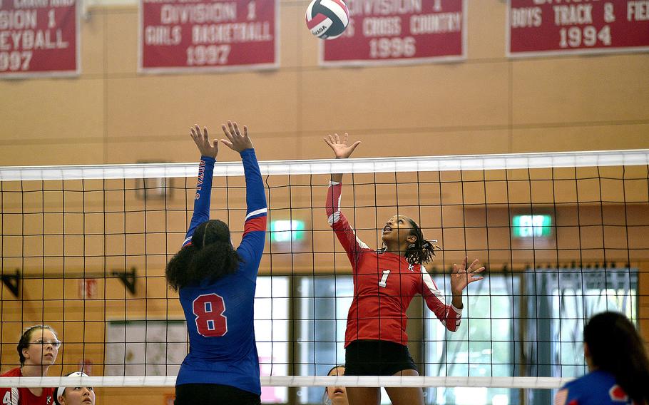 Raider Moriah Deane dinks the ball over Ramstein's Jasmine Jones duirng an Oct. 6, 2023, match at Kaiserslautern High School in Kaiserslautern, Germany.