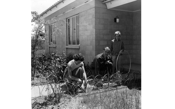 Seoul, South Korea, July 1959: Frances LiCalzi works on the flower garden in front of their home as her husband Maj. James S. LiCalzi, and her daughter Pamela look on. The LiCalzi family of five (Maj. and Ms. LiCalzi have two sons as well), moved into one of the 88 new homes in the  U.S. Korean Military Advisory Group (KMAG) housing compound at the Seoul Area Command in June 1959.The compound was designed to look like an American suburb with Western-looking, tile-roofed houses, broad paved streets and lush lawns. 

Read the story and see additional photos of the then new compound and the LiCalzi's and other KMAG families moving in here. 

META TAGS: South Korea; U.S. Korean Military Advisory Gp. (KMAG); military family; dependents; Seoul Area Command