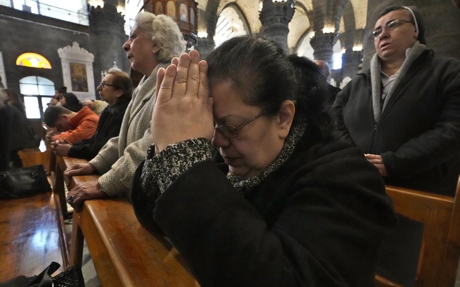 Syrian Christians pray during Sunday Mass.