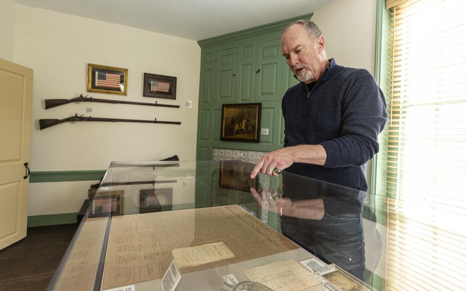 Owner Dan Wheeler talking about the various historical items in the first room of the small museum on the second floor of the newly reopened Man Full of Trouble Tavern in Philadelphia. 