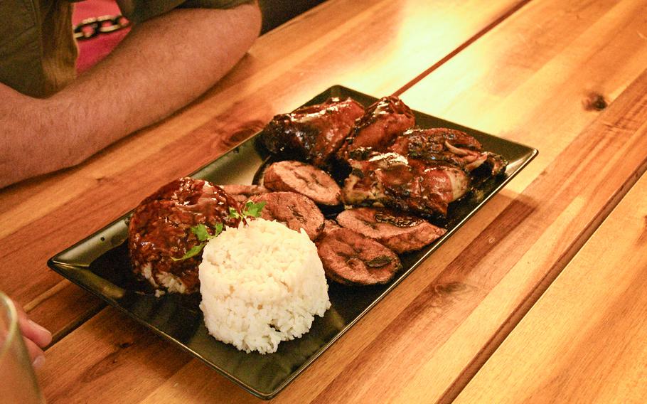 The signature dish of Good Vibes, a Jamaican restaurant in Kaiserslautern, Germany, is jerk chicken, which is marinated in spices before being cooked on a barbecue. 