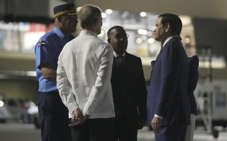 U.S. Secretary of State Marco Rubio is received by Foreign Minister Roberto Álvarez, second left, on the tarmac of Las Americas International Airport in Santo Domingo, Dominican Republic, Wednesday, Feb. 5, 2025.