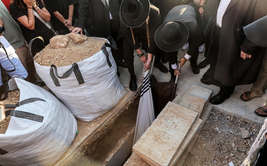 Hersh Goldberg-Polin is buried during his funeral at Givat Shaul cemetery in Jerusalem.