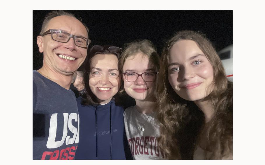 Kurmasheva, second from left, her daughters and her husband moments after they were reunited at Joint Base Andrews. 