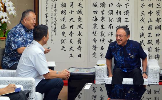 U.S. Consul General Andrew Ou, second from left, meets with Okinawa Gov. Denny Tamaki, right, at the prefectural office in Naha, Okinawa, Aug. 21, 2024.