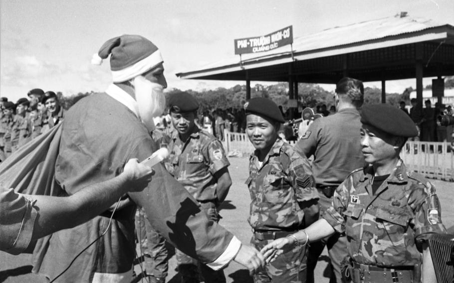 Santa wishes the men of Detachment 35, “B” Company, 5th Special Forces Group a Merry Christmas just after he leaves the plane.