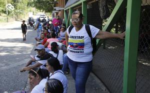 Venezuelans wait for their loved ones to be released outside of a prison in San Francisco de Yare, Venezuela, Nov 16, 2024.