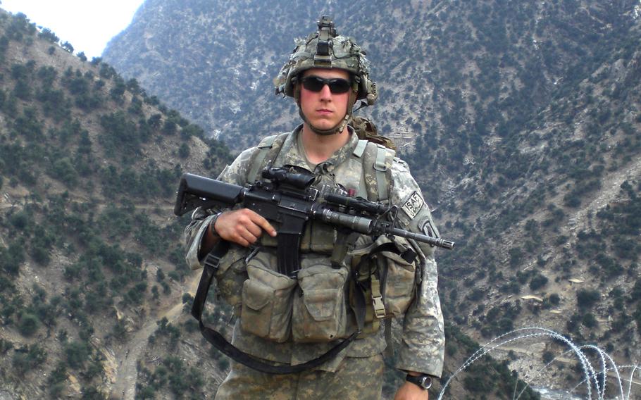 Then-Sgt. Ryan Pitts takes a break from building a traffic control point northeast of Combat Outpost Bella, Afghanistan, spring 2008. Pitts was awarded the Medal of Honor for his actions during the Battle of Wanat in July 2008.