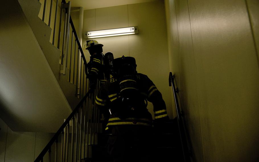 A team works toward climbing 110 stories during a 9/11 memorial stair-climb challenge at Yokota Air Base, Japan, Wednesday, Sept. 11, 2024. 