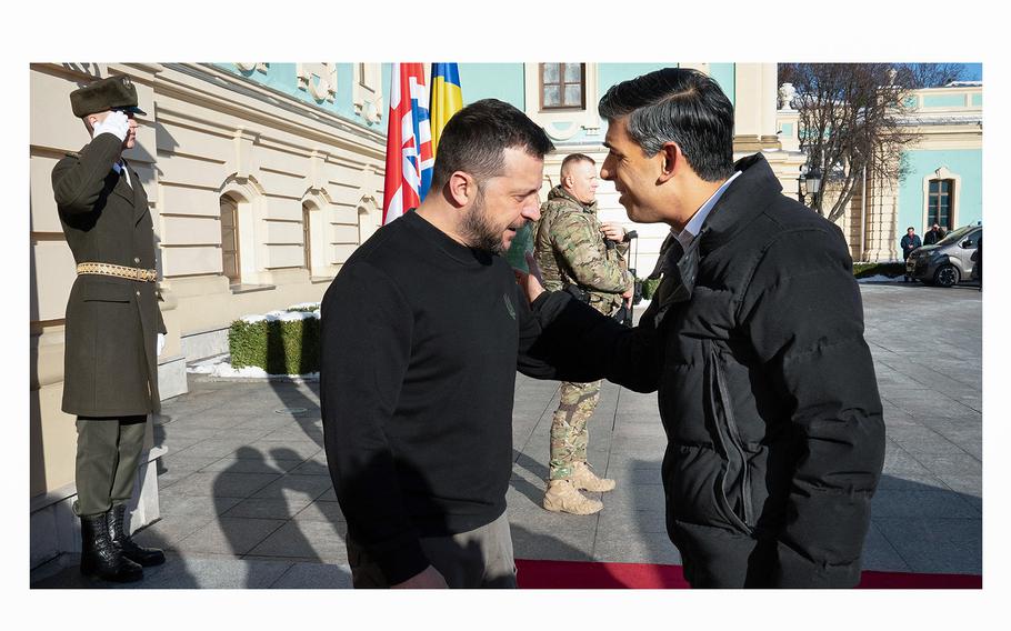 Ukrainian President Volodymyr Zelenskyy, left, greets Britain's Prime Minister Rishi Sunak upon his arrival to the Presidential Palace in Kyiv on Jan. 12, 2024. 