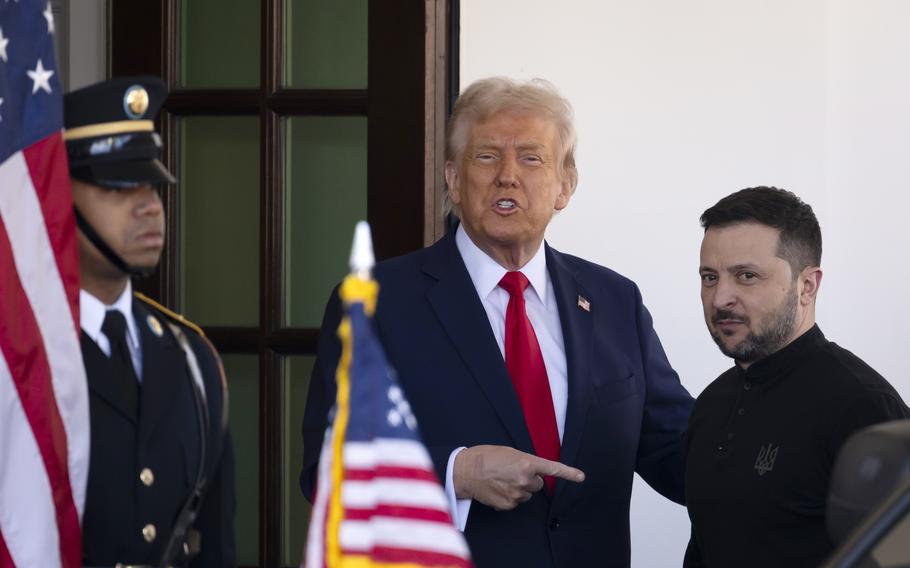 Ukraine President Volodymyr Zelenskyy, right, is greeted by President Donald Trump, center, as he arrives at the White House.