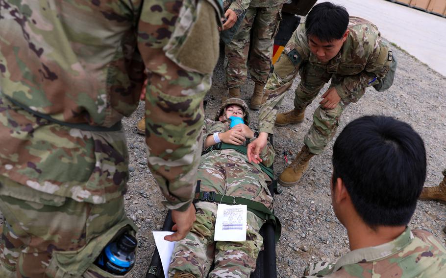 Soldiers assigned to the 65th Medical Brigade prepare to transport a simulated casualty during an Ulchi Freedom Shield drill in Pocheon, South Korea, Aug. 26, 2024.