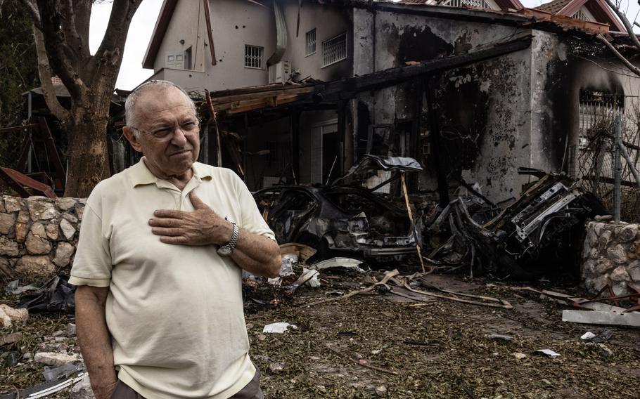 Moti Fitch outside his damaged home in Moreshet