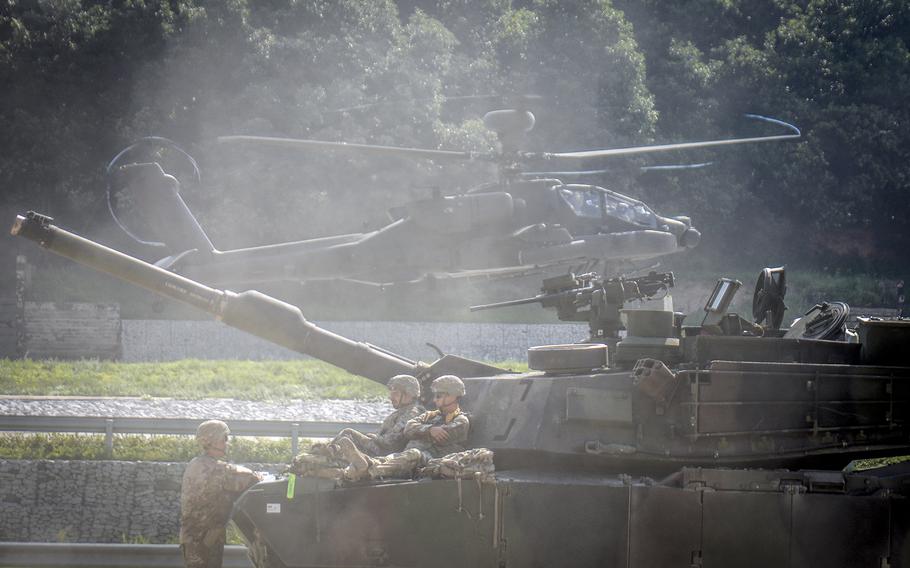 A tank crew assigned to 1st Armored Brigade Combat Team, part of the 1st Armored Division from Fort Bliss, Texas, stands by at Rodriguez Live Fire Complex in Pocheon, South Korea, Aug. 14, 2024. 