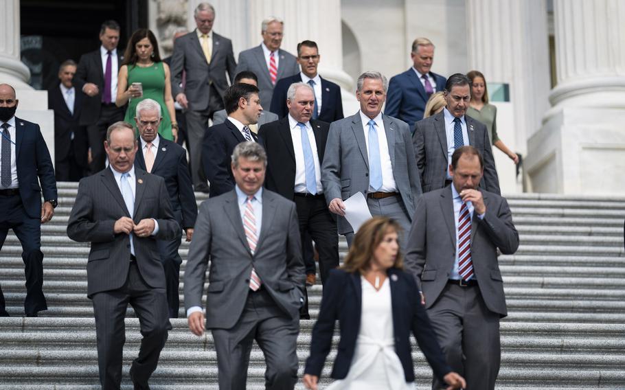 House Minority Leader Kevin McCarthy, R-Calif., walks out with other Republican members to speak about the leadership of Speaker of the House Nancy Pelosi, D-Calif., and President Biden from the House steps on Capitol Hill on July 29, 2021 in Washington. 