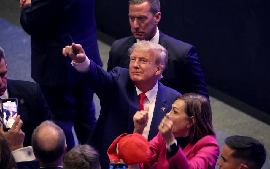 Former President Donald Trump greets guests following an event at the Adler Theatre on March 13, 2023, in Davenport, Iowa.