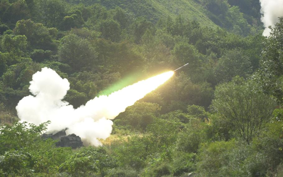 A practice rocket is fired out of the (MLRS) multiple launch rocket system vehicle