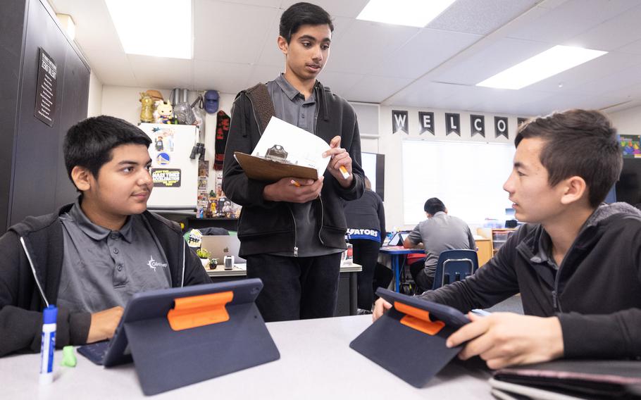 Student teacher Ayaan Khurram helps classmates in an 8th grade math class at Gilroy Prep in Gilroy, Calif., May 2. Under the supervision of instructors, student teachers help their classmates at the charter school grasp their STEM and language arts studies. 