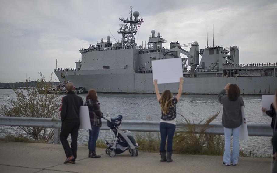  Families gather to welcome home the amphibious dock landing ship USS Tortuga (LSD 46) after changing homeports from Sasebo, Japan to Joint Expeditionary Base Little Creek-Fort Story on Oct. 22, 2013.