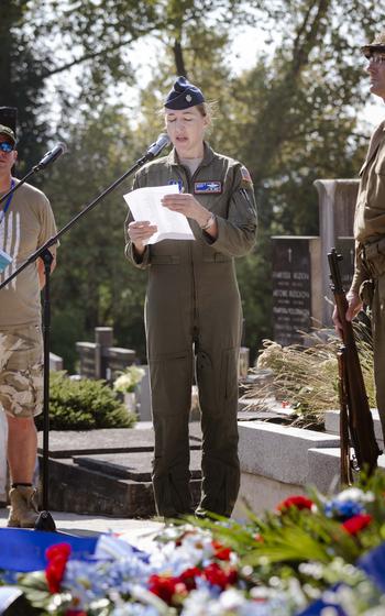 Air Force Lt. Col. Sasha Heath, a KC-10 pilot and great-niece of one of the fallen airmen, reads the names of all 28 World War II American service members who were buried in a mass grave in Slavicin, Czech Republic, on Aug. 31, 2024. Family members and residents gathered to commemorate the 80th anniversary of the Battle over the White Carpathians in the Czech Republic and Slovakia from Aug. 29-Sept. 1.