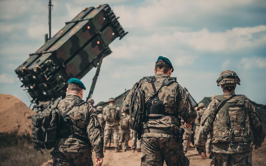 Soldiers from the U.S. and Polish armies walk to the site of Patriot missile system near Drawsko Pomorskie, Poland, in 2018. A second U.S. loan to Poland of $2 billion will be used to buy American air and missile defense systems, the Polish Defense Ministry said.