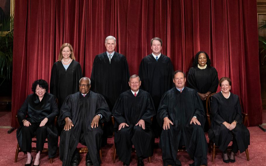 Members of the Supreme Court sit for a group photo in 2022 in Washington, D.C. The Supreme Court ruled on Friday that prosecutors improperly charged hundreds of Jan. 6 defendants with obstruction.