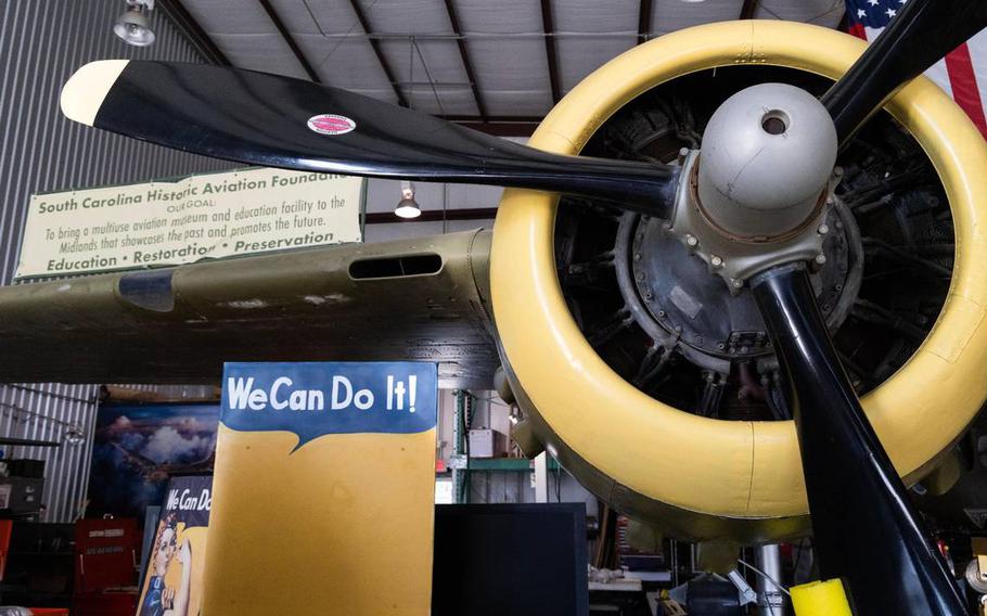 Ron Skipper and Katherine Cuddy show a restored B-25C at Owens Field Airport in South Carolina on Monday, Aug. 7, 2023.