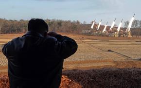 This image from the state-run Korean Central News Agency shows North Korean leader Kim Jong Un observing a launch drill on March 18, 2024. 