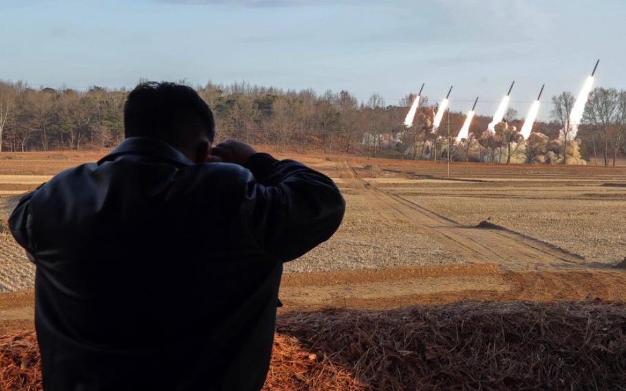 North Korean leader Kim Jong Un watches a launch drill. 