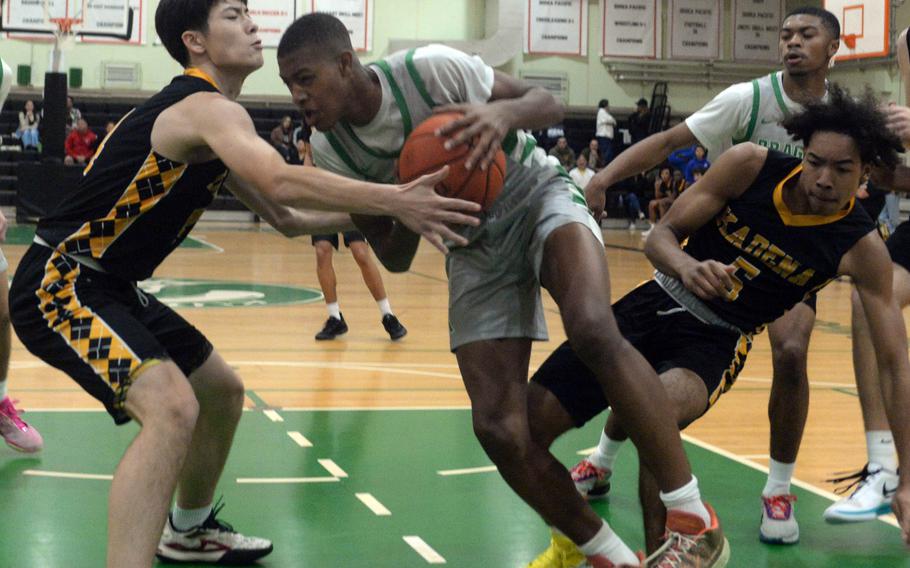 Alex James tries to get closer to the basket.