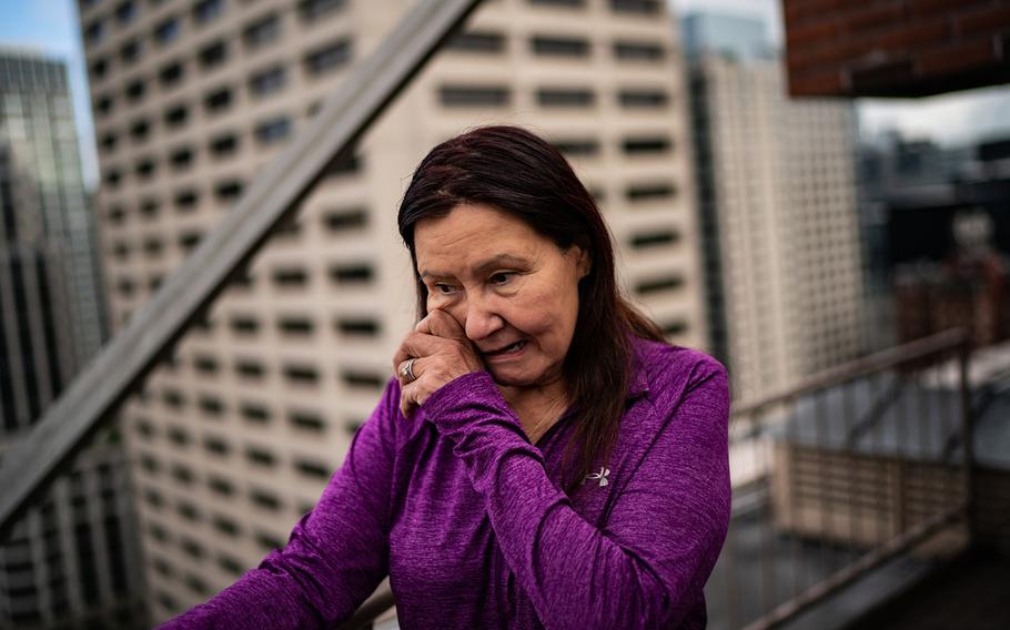 Rachel Twitchell-Justiss stands atop the roof of the Hotel Theodore on Aug. 29, 2023.