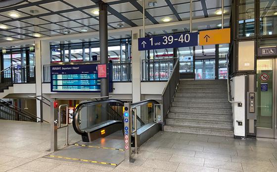 Inside the Kaiserslautern, Germany, main train station,with stairs and escalators leading to the track platforms.