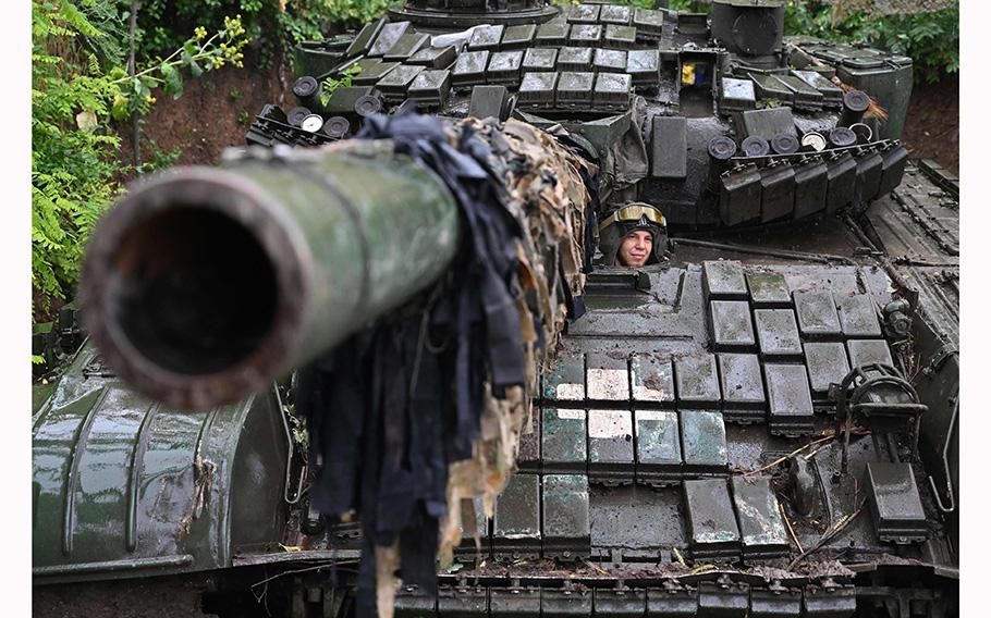 A Ukrainian serviceman sits on a T-72 tank at a position in the Donetsk region on June 25, 2023, amid the Russian invasion of Ukraine. 