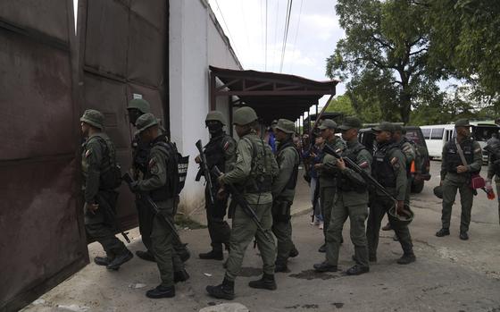 FILE - Soldiers raid the Tocorón Penitentiary Center, in Tocorón, Venezuela, Sept. 20, 2023. The Tren de Aragua gang originated at the prison. (AP Photo/Ariana Cubillos, File)