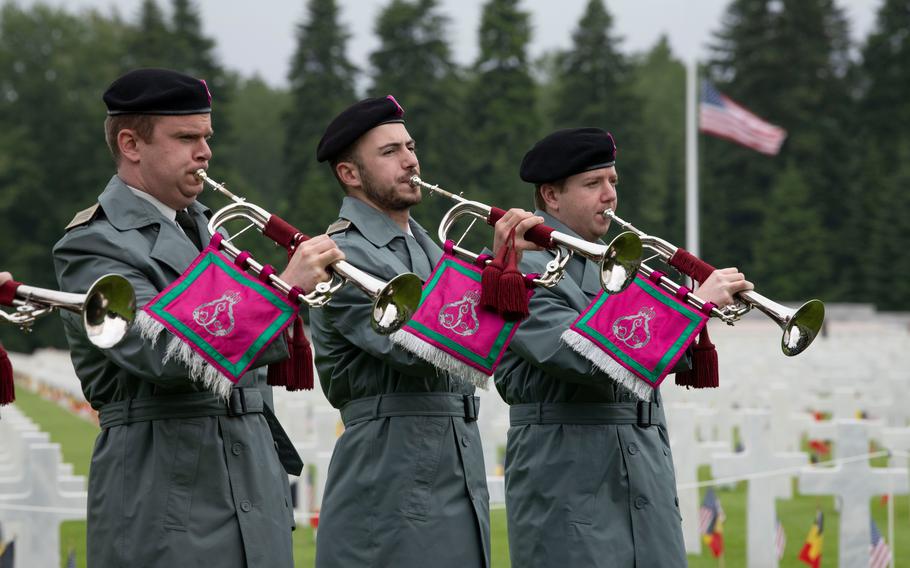 Members of Belgium’s Royal Music of the Guides play taps at a Memorial Day ceremony at Ardennes American Cemetery in Neupré, Belgium, on May 25, 2024. 