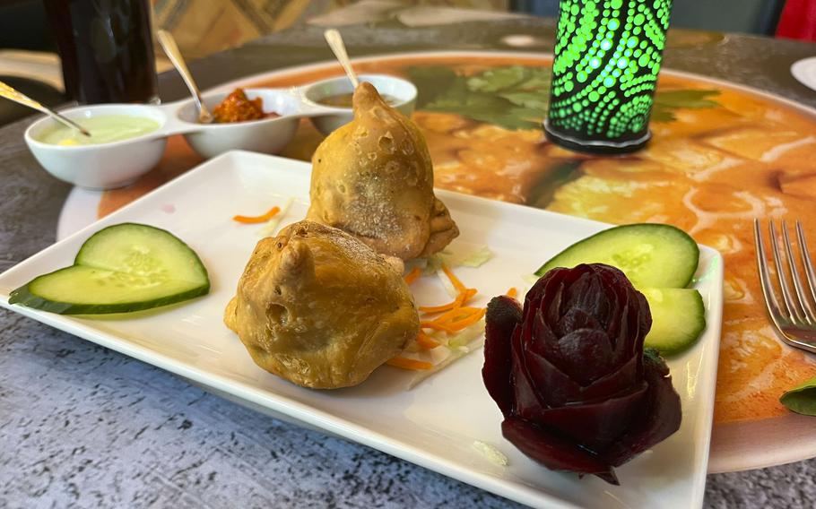 Samosa appetizers at Singh's Tandoori Indian Restaurant in Wiesbaden, Germany. The savory, deep-fried pastries are filled with a mixture of spiced potatoes and peas. 
