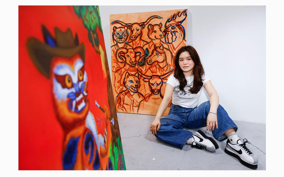 Christina Hahn, founder of the Dallas Asian American Art Collective, poses for a portrait with her art works, at her workstation in The Cedars Union on Friday, March 29, 2024, in Dallas.