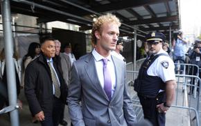 Daniel Penny, right, charged with manslaughter for placing a man in a deadly chokehold aboard a New York City subway train, departs Manhattan Criminal Court, Thursday, Oct. 3, 2024, in New York. (AP Photo/Pamela Smith)